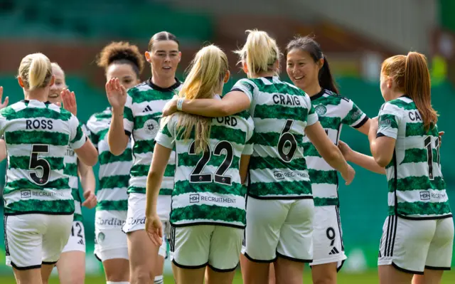 Celtic's Lucy-Ashworth-Clifford (C) celebrates after scoring to make it 1-0 with teammates Natasha Flint (L) and Shen Mengyu (R) during a Scottish Women's Premier League match between Celtic and Heart of Midlothian