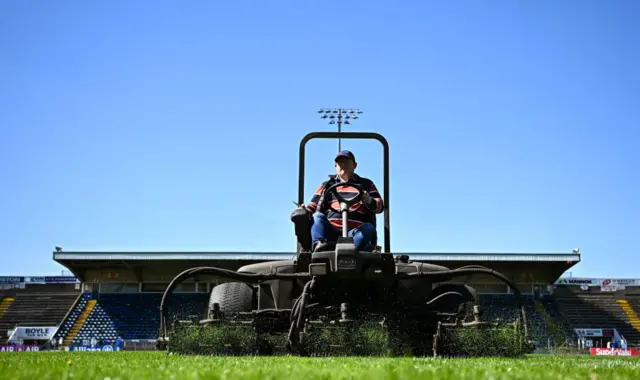 The grounds staff prepare the pitch ahead of throw-in