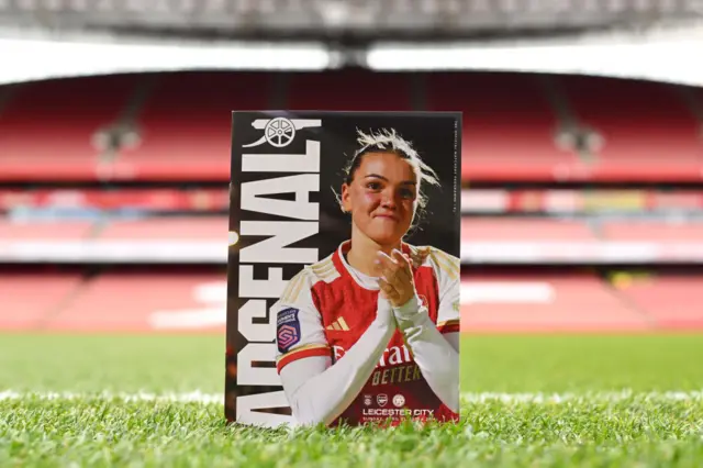 Laura Wienroither on the match programme that stands on the Emirates touchline