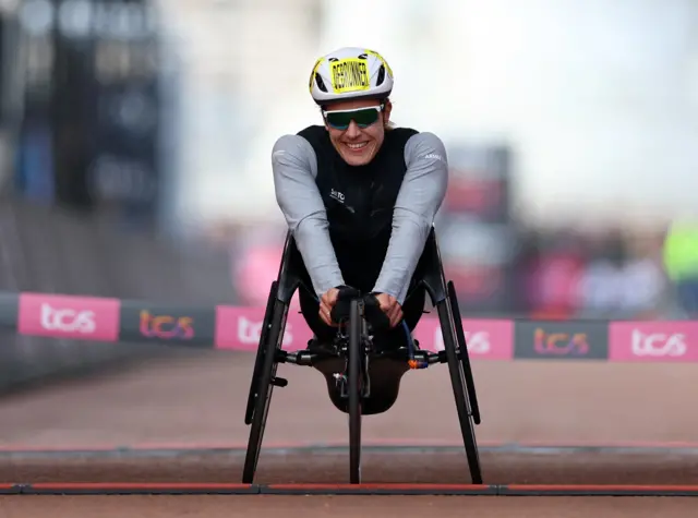 Catherine Debrunner celebrates winning the 2024 women's wheelchair race at London Marathon