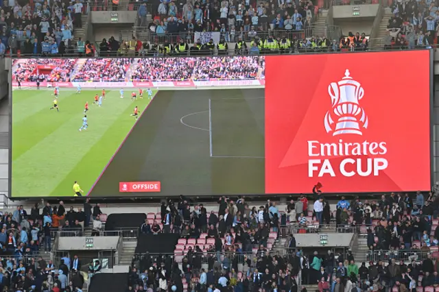 The big screen displays the graphic image showing an offside