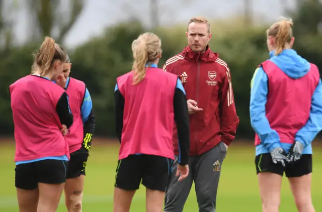 Jonas Eidevall speaks to his player during training