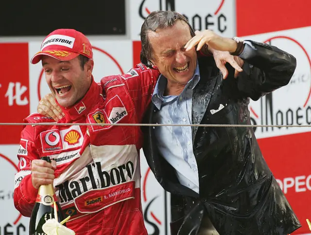 Rubens Barrichello of Brazil and Ferrari celebrates with Ferrari team Principle Luca di Montezemolo