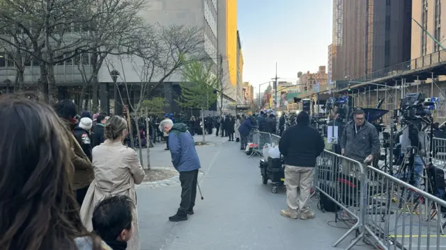 People assemble outside a court building in New York