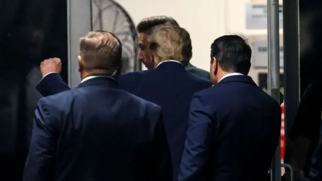 NEW YORK, NEW YORK - APRIL 22: Former U.S. President Donald Trump gestures as he leaves court for a recess