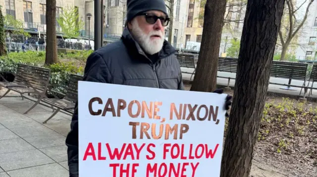 A protester outside Trump's court trial