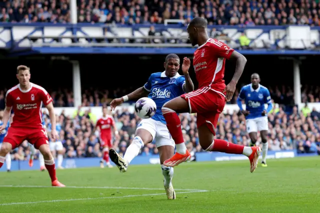 Everton's Ashley Young attempts to tackle Callum Hudson-Odoi in the penalty area before Nottingham Forest's claims for a handball are dismissed by officials