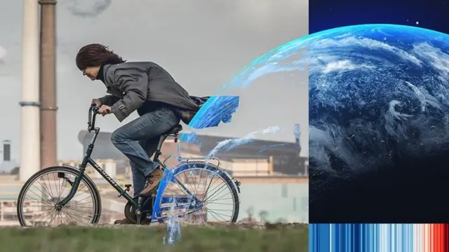 Woman on bike cycling past factory