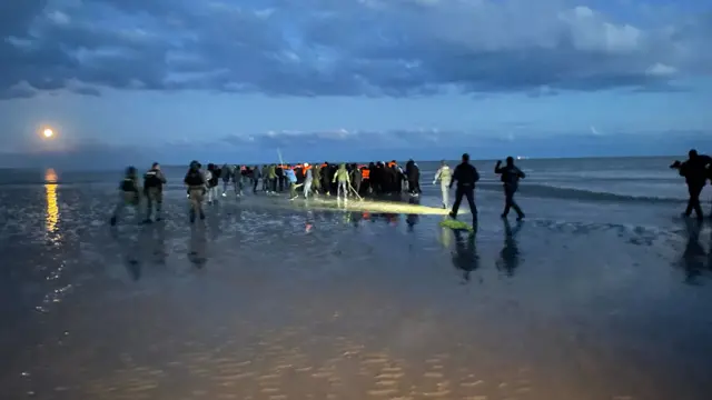 People on sand bar