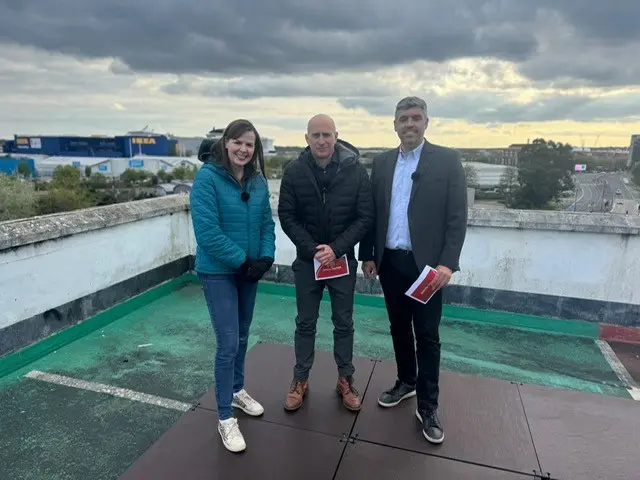 Alexis Green, Jon Cuthill and Lewis Coombes on the rooftop