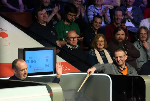 Mark Williams handed his cue to a spectator