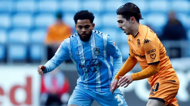 Hull's Abdulkadir Omur takes on Coventry's Jay Dasilva