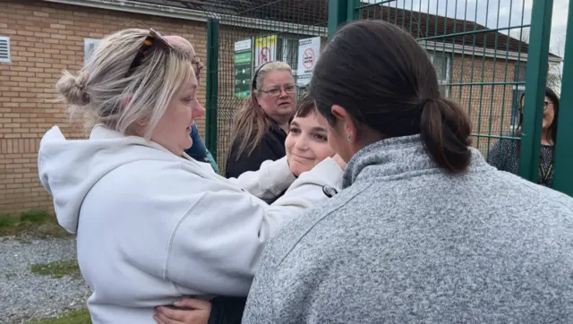 Parents react outside the school