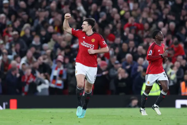 Maguire pumps his fist towards the stands after his goal