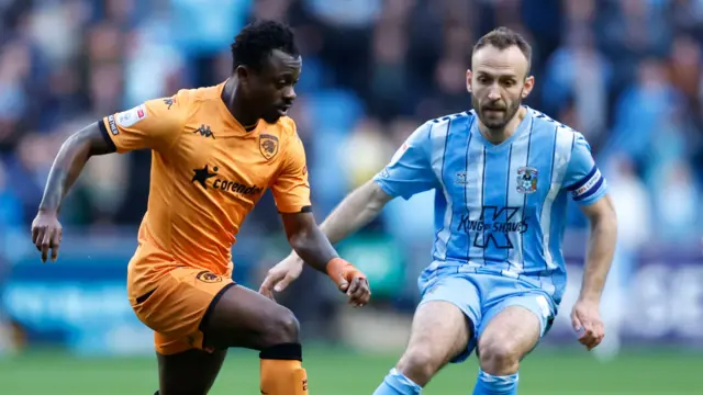 Hull's Jean Michael Seri takes on Coventry's Liam Kelly