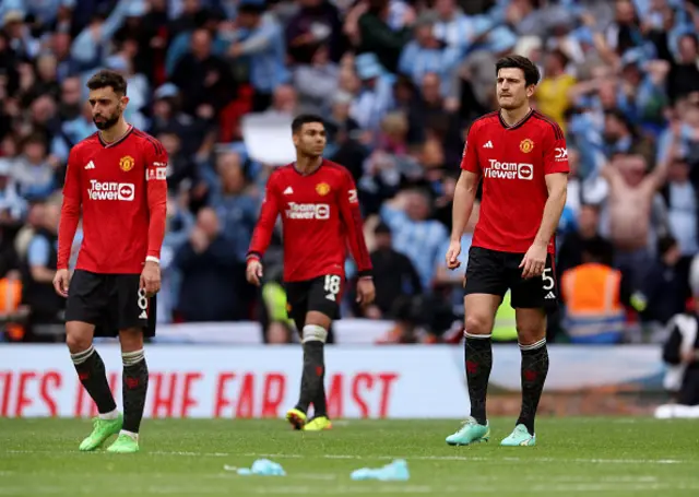 Harry Maguire of Manchester United looks dejected during the FA Cup semi-final