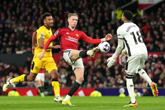 Foderingham and McTominay collide in the box