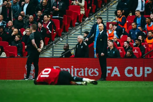 Erik ten Hag looks on as Marcus Rashford lays down during the FA Cup semi-final