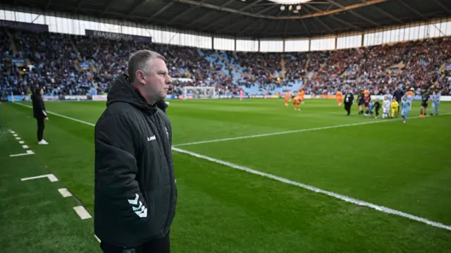 Coventry boss Mark Robins on the sidelines