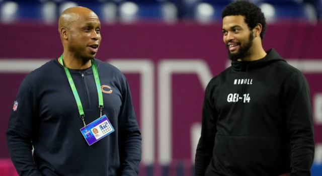 Chicago Bears quarterbacks coach Kerry Joseph talking to Southern California quarterback Caleb Williams during the 2024 NFL Combine