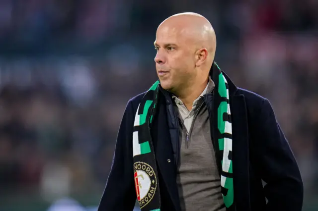 Arne Slot with a Feyenoord scarf around his shoulders