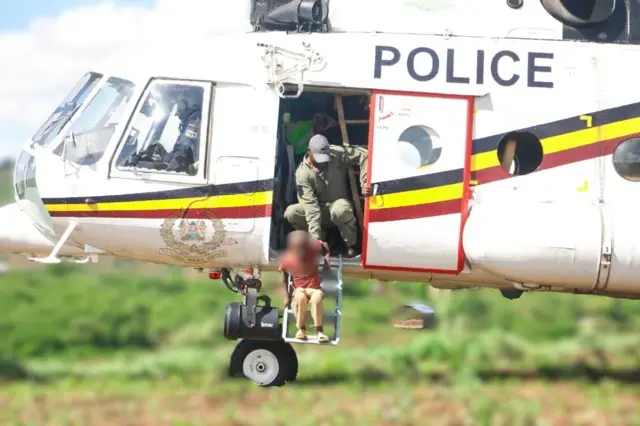 Five-year-old boy marooned by floods saved by police helicopter in Kenya