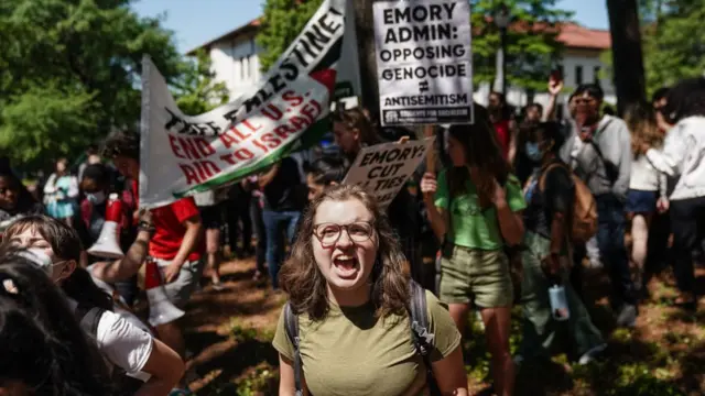 A sign reads: "Emory admin opposing genocide does not equal antisemitism"