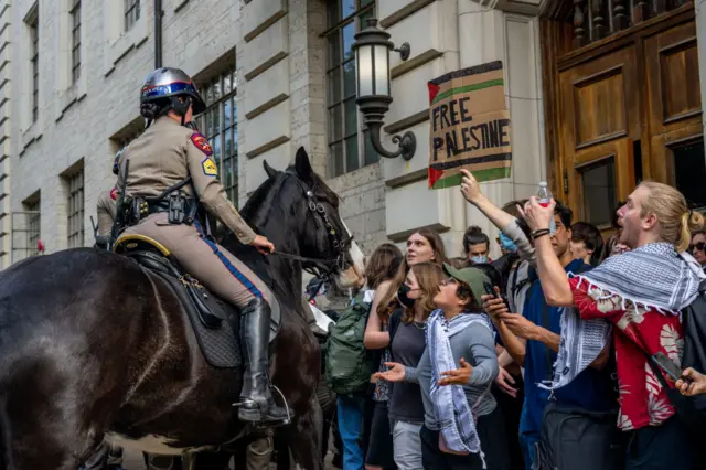 Police on horseback work to dispel a crowd of pro-Palestinian protesters