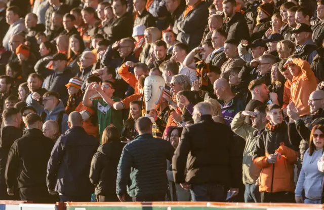 Dundee United fans during a cinch Championship match between Airdrionians and Dundee United at Excelsior Stadium, on April 26, 2024, in Airdrie, Scotland.