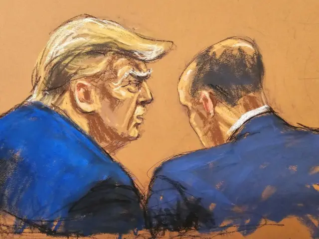 Emil Bove and former U.S. President Donald Trump chat during Trump's criminal trial on charges that he falsified business records to conceal money paid to silence porn star Stormy Daniels in 2016, in Manhattan state court in New York City, U.S. April 26, 2024,