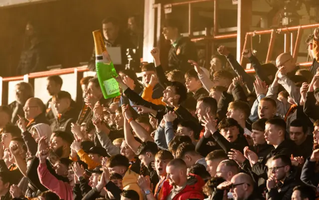 Dundee United fans during a cinch Championship match between Airdrionians and Dundee United at Excelsior Stadium, on April 26, 2024, in Airdrie, Scotland.