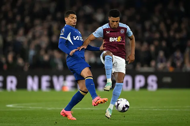 Ollie Watkins of Aston Villa controls the ball whilst under pressure from Thiago Silva