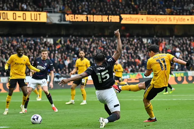 Hwang Hee-chan shoots to score the opening goal