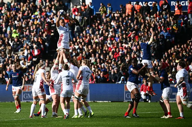 England's flanker Sadia Kabeya grabs the ball