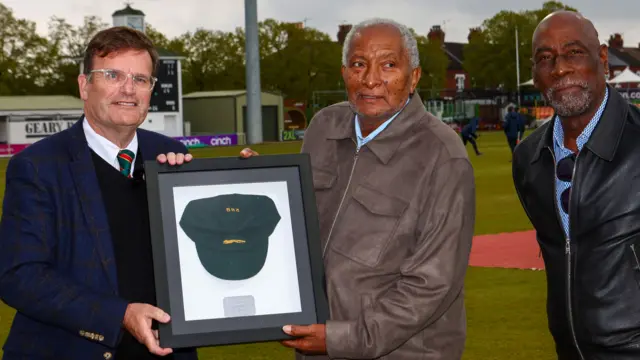 Leicestershire chairman John Thorpe presents Sir Andy Roberts with his framed Club Cap with Sir Vivian Richards