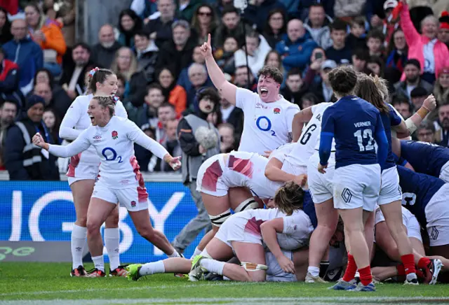 Jess Breach, Natasha Hunt and Hannah Botterman celebrate after Amy Cokayne of England (obscured) scores