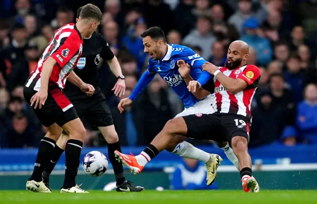 McNeil dribbles through the Brentford midfield