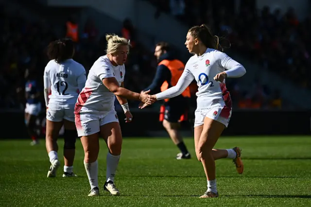 Holly Aitchison celebrates with England's number-8 Marlie Packer