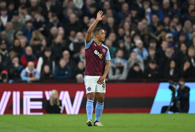 Youri Tielemans of Aston Villa gestures towards the technical area