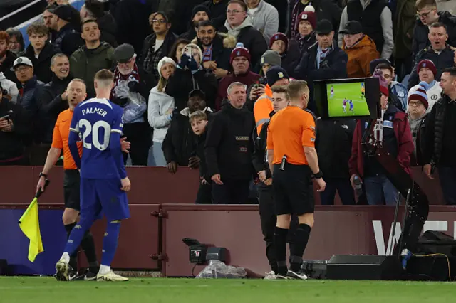 Referee Craig Pawson looks at a monitor