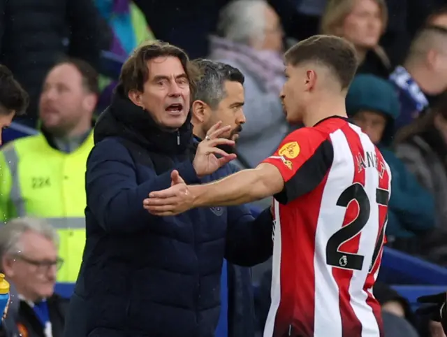 Frank has a word with Janelt on the sideline