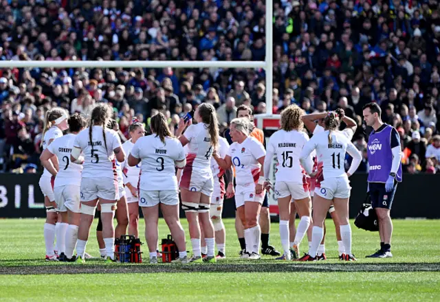 Marlie Packer of England speaks with teammates