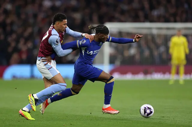 Noni Madueke of Chelsea is challenged by Morgan Rogers