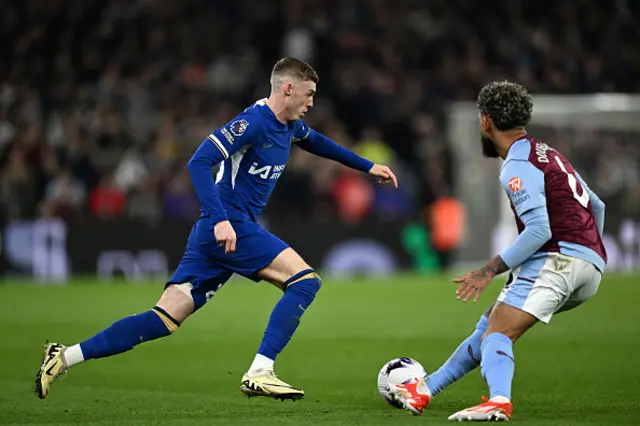 Cole Palmer of Chelsea runs with the ball whilst under pressure from Douglas Luiz