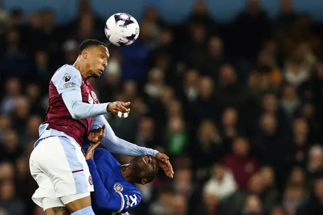 Ezri Konsa (L) jumps over Chelsea's Senegalese striker #15 Nicolas Jackson