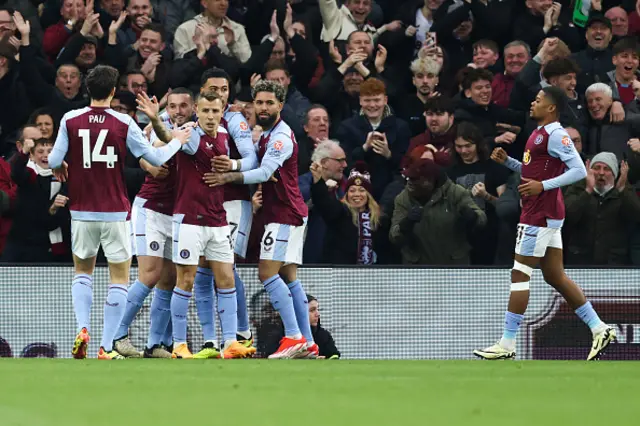 Aston Villa players celebrate the opening goal