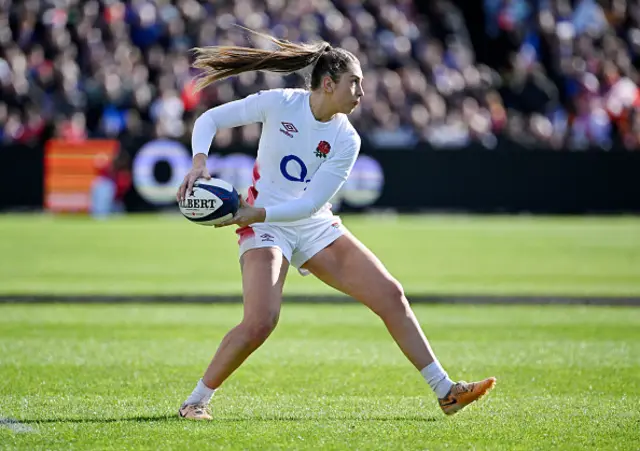 Holly Aitchison of England looks to pass the ball