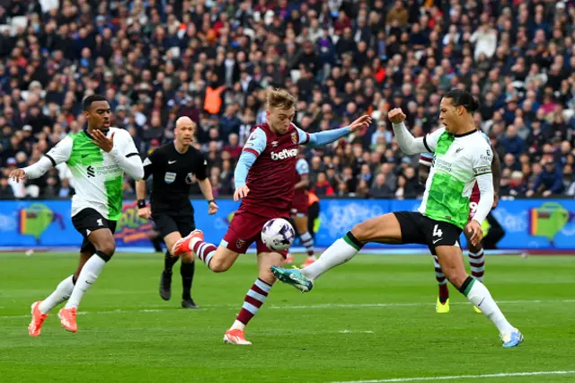 Jarrod Bowen of West Ham United shoots under pressure from Virgil van Dijk