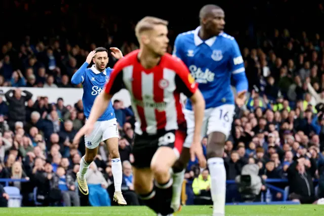 McNeil reacts to his shot hitting the bar