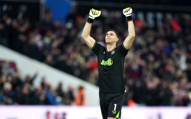 Emiliano Martinez celebrates their side's first goal of the game,